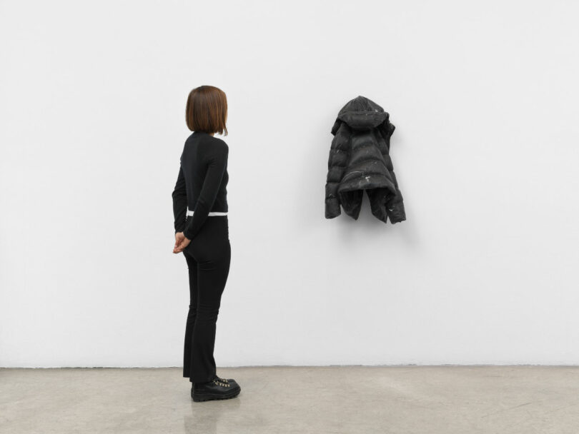 woman with stone jacket carving