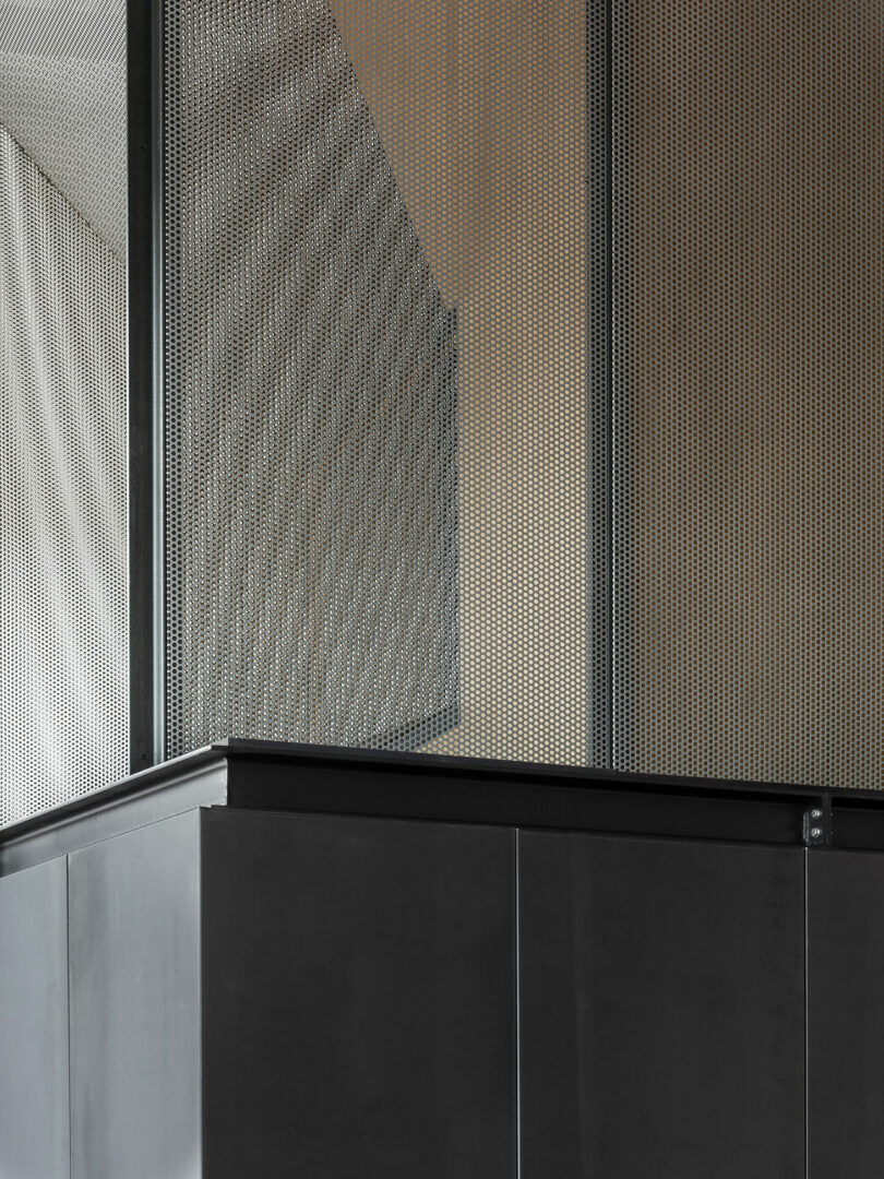 angled up shot of mesh balcony of modern loft's mezzanine