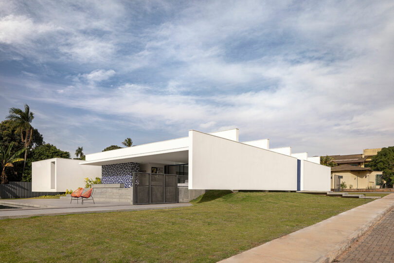 angled exterior view of white rectilinear house