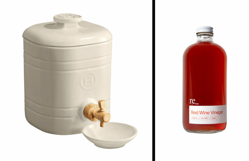 A white ceramic vinegar crock with a wooden spigot and small dish sits beside a clear glass bottle labeled "Red Wine Vinegar"—a charming addition and perfect for gifts for cooks.